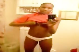 Stripping and masturbating ardently in front of a mirror
