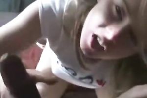 Blonde cutie sucks a dark dong and gets her smooth vag slammed