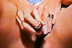 A lustful doxy pulls her strap aside and toys her bald bawdy cleft