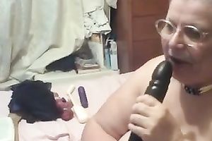Old corpulent cam bitch in glasses sucks large marital-device on livecam