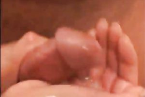 Chick gives a chap a cook jerking in the shower and swallows some of its cum