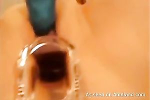 Horny honey receives a speculum in her taut slit and demonstrates all this babe got