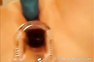 Horny honey receives a speculum in her taut slit and demonstrates all this babe got