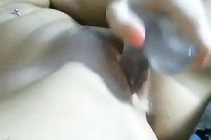 This consummate camgirl with large mangos is playing with her glass fake penis