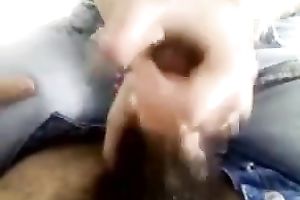 She begins playing with my ramrod and makes me cum on cam