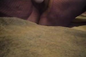 Super bulky and large white woman plays with her cookie on her sofa