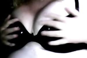 Full bosomed whore in glasses is engulfing her own nipples