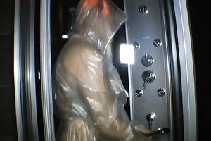 Chubby older golden-haired takes a shower during the time that wearing a raincoat