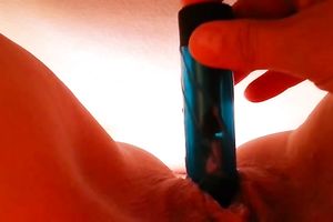 I love to stuff my bald slit with my miniature dildo