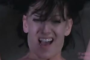 Trashy wench is fastened to a wooden pole for castigation