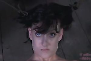 Trashy wench is fastened to a wooden pole for castigation