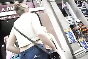 This sultry woman with hot round butt looks nice in her constricted jeans