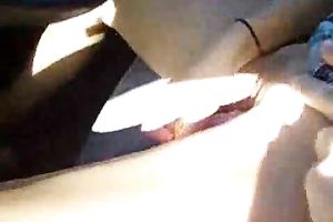 Shameless housewife drives the car during the time that petting her snatch with vibrator