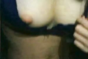 Attractive black-haired cutie flashes her elastic bra buddies on cam