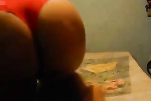 Thich plump gazoo of a black skin dark brown milf appears on livecam