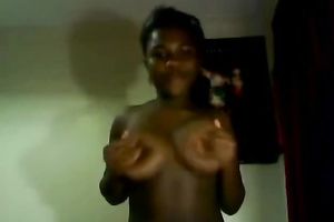 Mesmerizing black teen sweetheart with large breasts shows it all