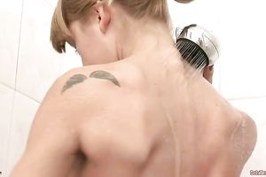 Pretty gal with diminutive scones washes her slender body in shower