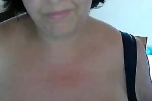 Mature German wench sucks a sex toy previous to pushing it in her fur pie