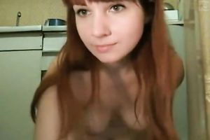 Webcam solo with a redhead teen fingering her pussy in the kitchen