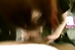 Marvelous redhead non-professional cutie gives head on the movie scene