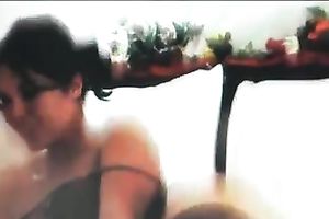 Sexy brunette hair doxy teases with her body in front of a livecam