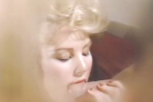 Adorable classic blond gives blow job to a duet of studs