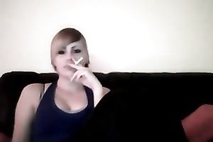 This punk wench knows how to smoker seductively on camera