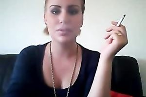 This punk wench knows how to smoker seductively on camera