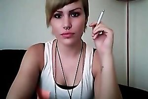 This punk wench knows how to smoker seductively on camera